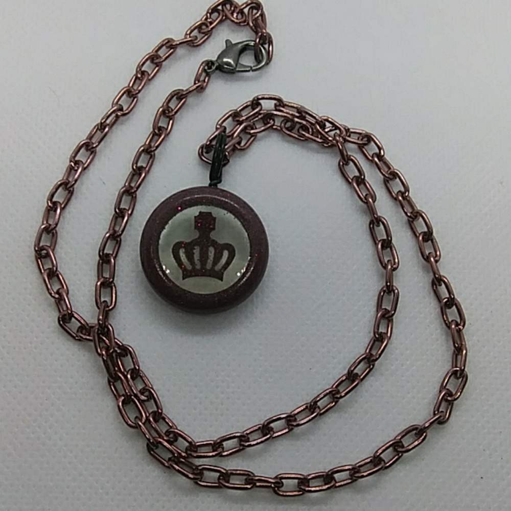Resin pendant with resin crown inside